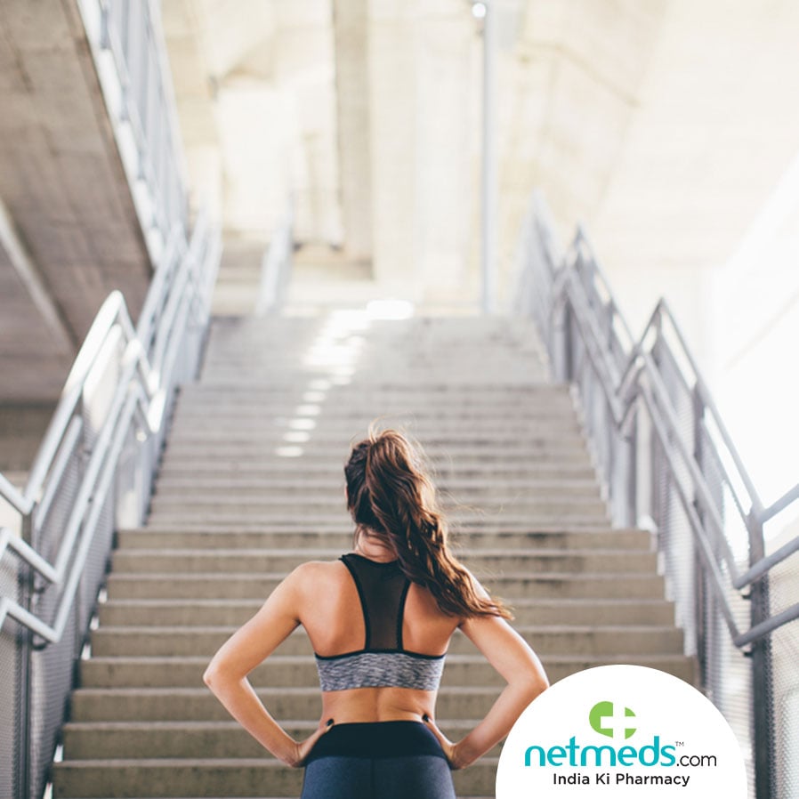 Woman getting ready to Climb the stairs as a workout