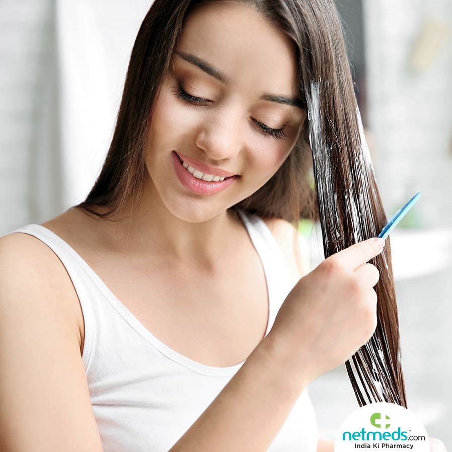 Woman combing her hair