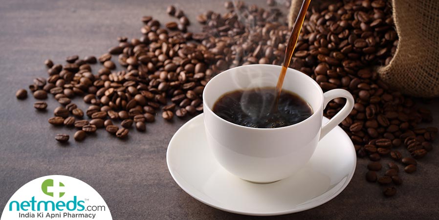 Pouring black coffee in the cup