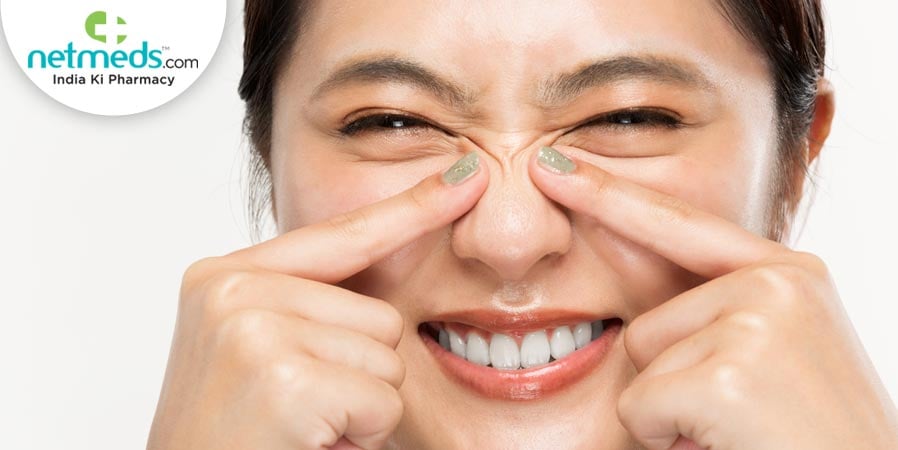 Woman squeezing her nose