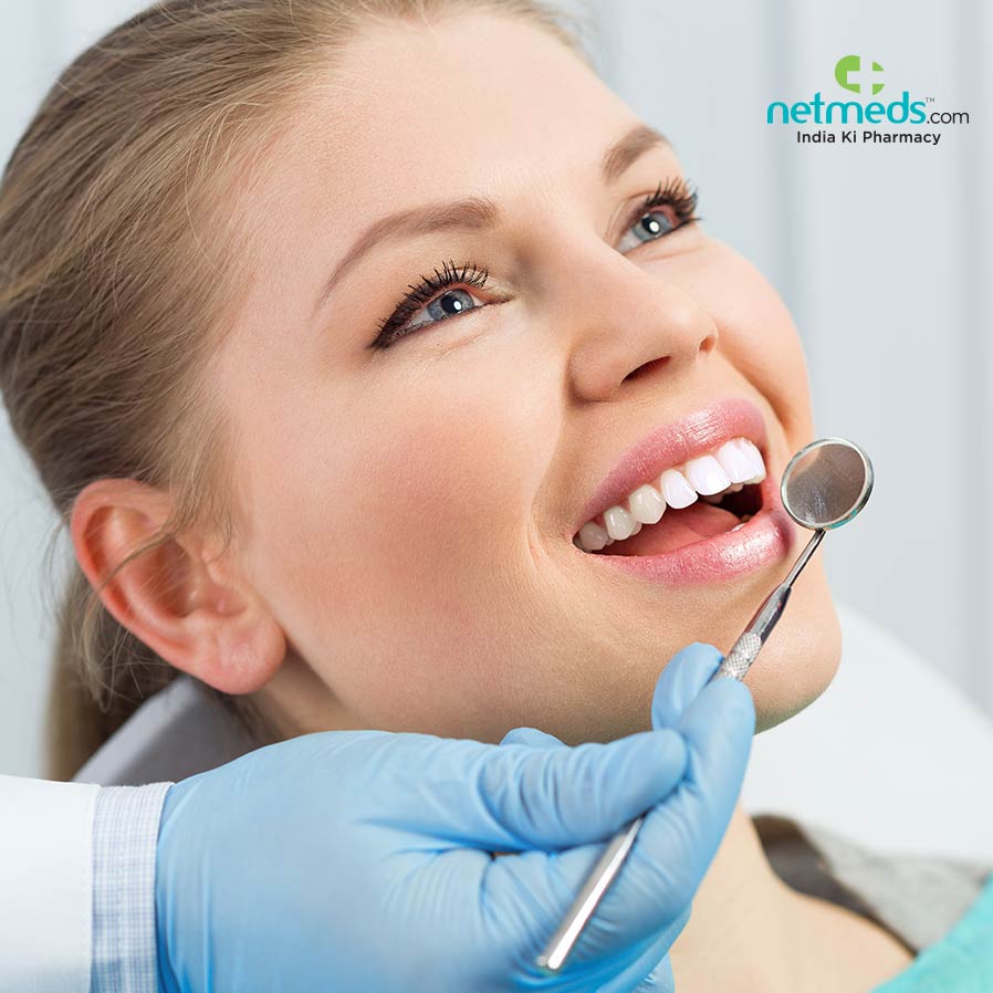 Dentist checking a girl's teeth