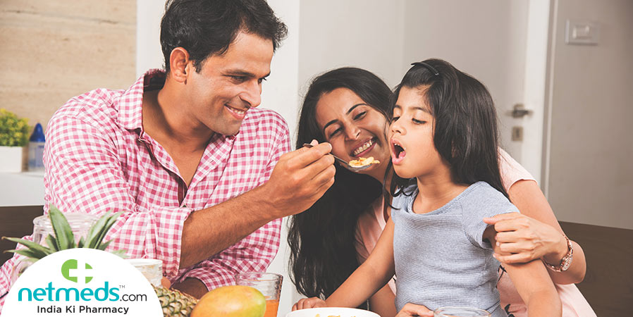 Father feeding a child