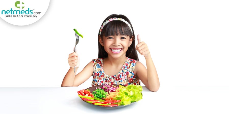 Girl eating vegetables