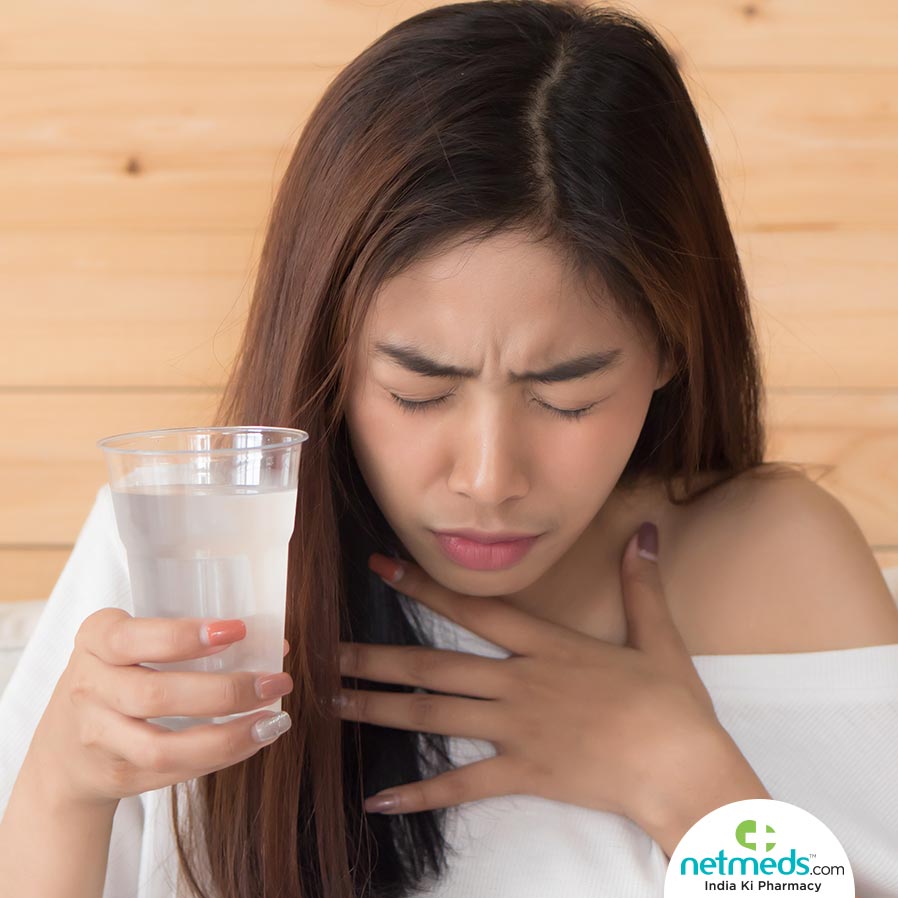 Woman drinking water for hiccups