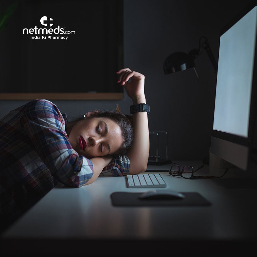 Woman sleeping in front of the computer