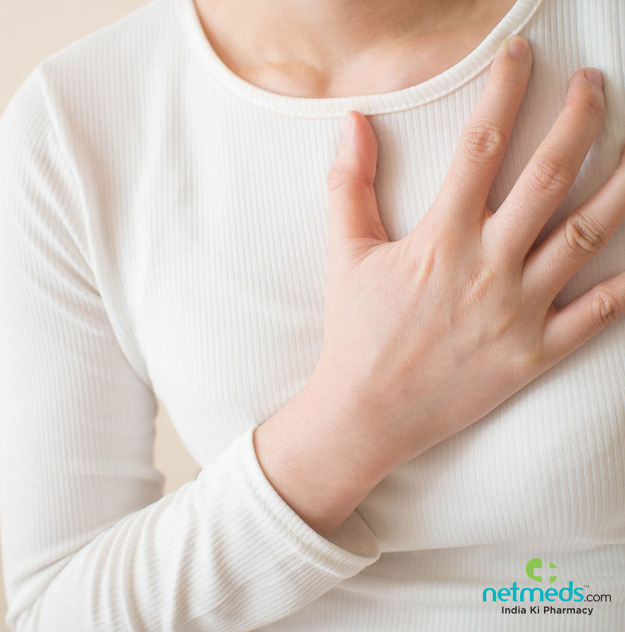 Woman with hand on chest
