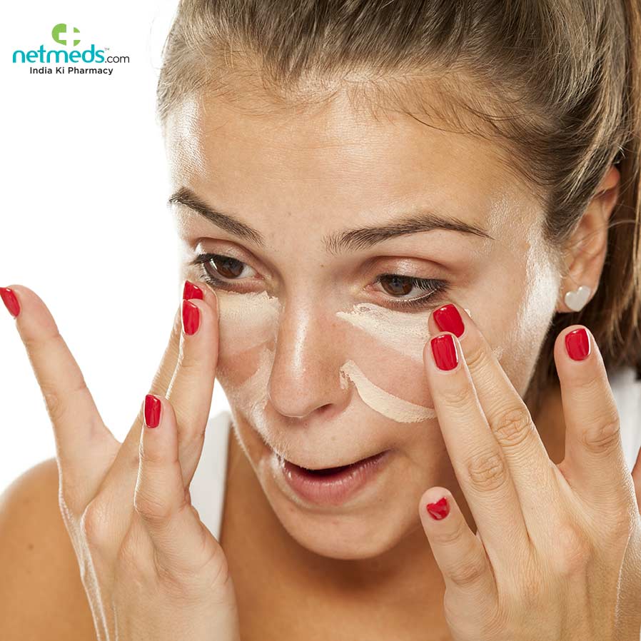 Woman Applying Cream To Get Rid Of Dark Circles