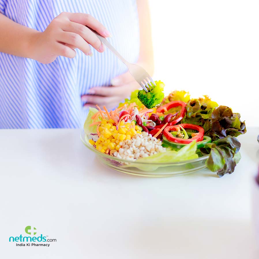 Pregnant woman eating healthy food