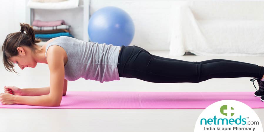 Woman doing planks for spine health