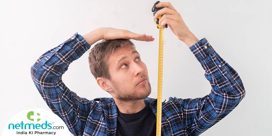 Man measuring his height