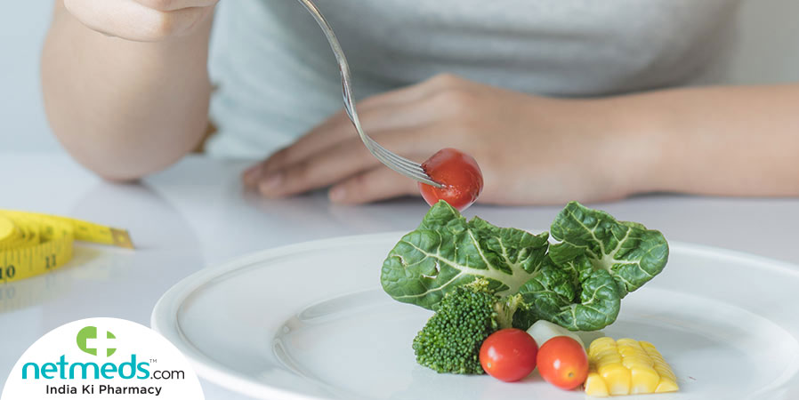 Eating small amount of vegetables from a plate