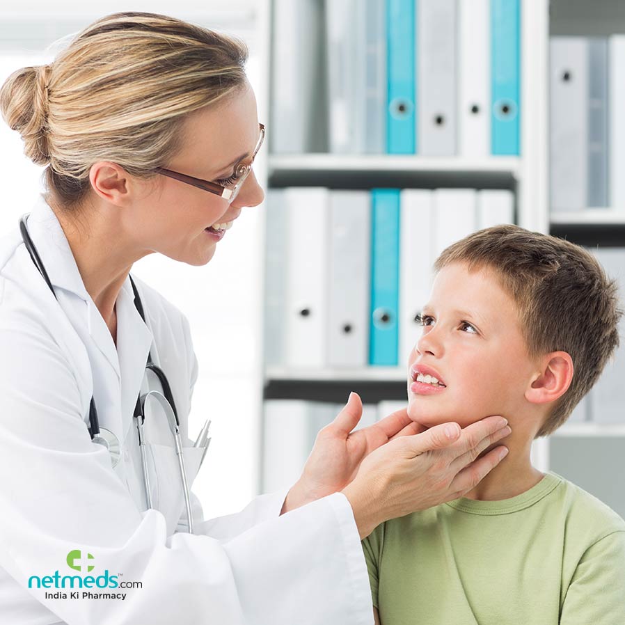 Doctor checking for thyroid on kid