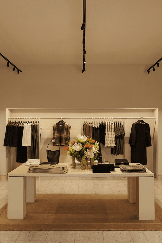 COS store interior with a central display table